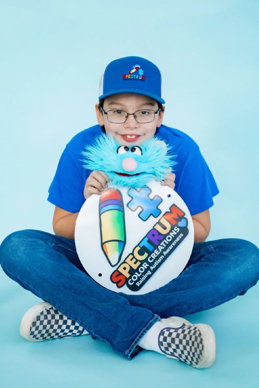Child holding Spectrum Color Creations product